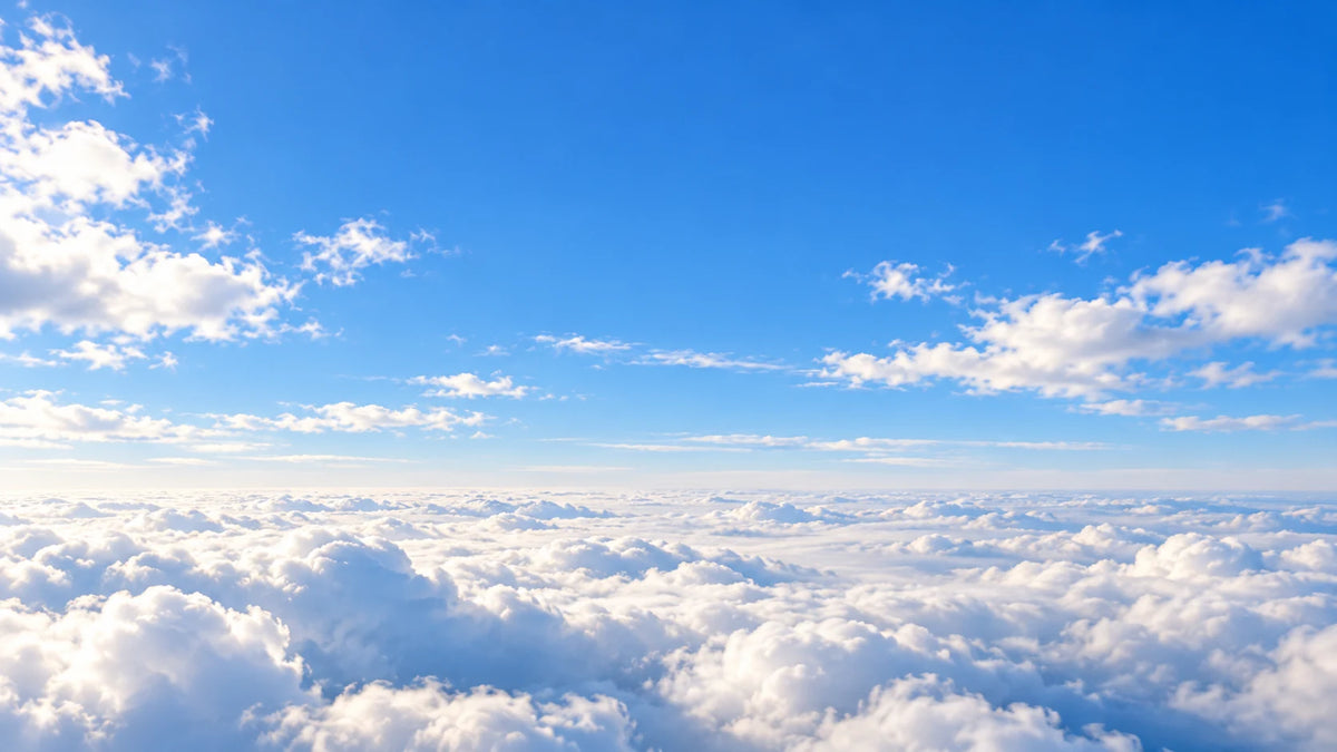 Blue sky above soft clouds